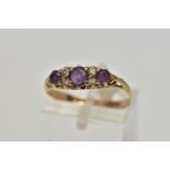 A 9CT GOLD AMETHYST AND CUBIC ZIRCONIA DRESS RING, the graduated circular cut amethysts and cubic