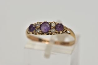 A 9CT GOLD AMETHYST AND CUBIC ZIRCONIA DRESS RING, the graduated circular cut amethysts and cubic