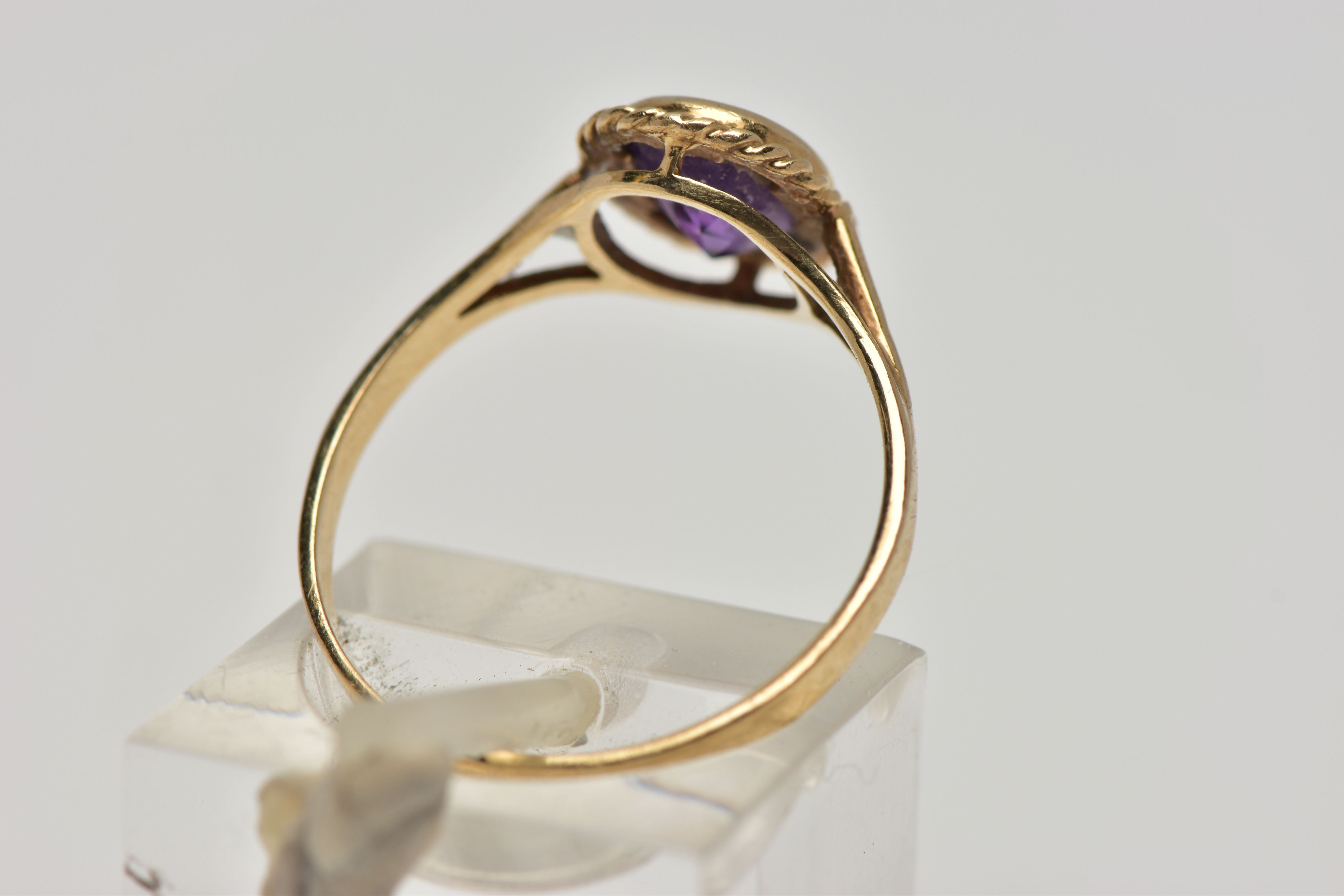 A 9CT GOLD AMETHYST SINGLE STONE RING, the oval cut amethyst within a collet setting, to the - Image 3 of 4