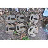 EIGHT GALATENT CAST IRON MARQUEE/GAZEBO WEIGHTS, and a pair of wrought iron bench ends (10)