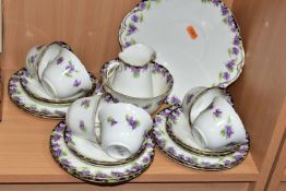 A TWENTY ONE PIECE ROYAL DOULTON VIOLETS H3747 TEA SET, comprising a cream jug, a sugar bowl, a cake