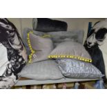 NINE CONTEMPORARY CUSHIONS, comprising two floor cushions approximately 75cm square, printed with