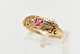 AN EARLY 20TH CENTURY 18CT GOLD RUBY AND DIAMOND RING, set with a central circular cut ruby, flanked