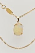 A YELLOW METAL OPAL PENDANT WITH CHAIN, the oval opal cabochon, with yellow metal cap, tapered