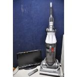 A DYSON DC07 VACUUM along with two oil filled electric heaters and a Techwood 19884hddvd 19in tv