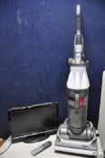 A DYSON DC07 VACUUM along with two oil filled electric heaters and a Techwood 19884hddvd 19in tv