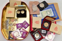 A TIN OF ASSORTED COINS AND COMEMMORATIVES, to include four boxed 'Canada' coins, two