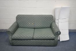A GREEN UPHOLSTERED TWO SEATER SOFA BED, and a mattress topper (condition - stains to mattress) (2)