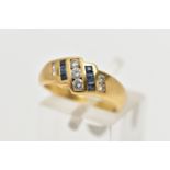 A YELLOW METAL SAPPHIRE AND DIAMOND DRESS RING, of geometric design, the principal brilliant cut