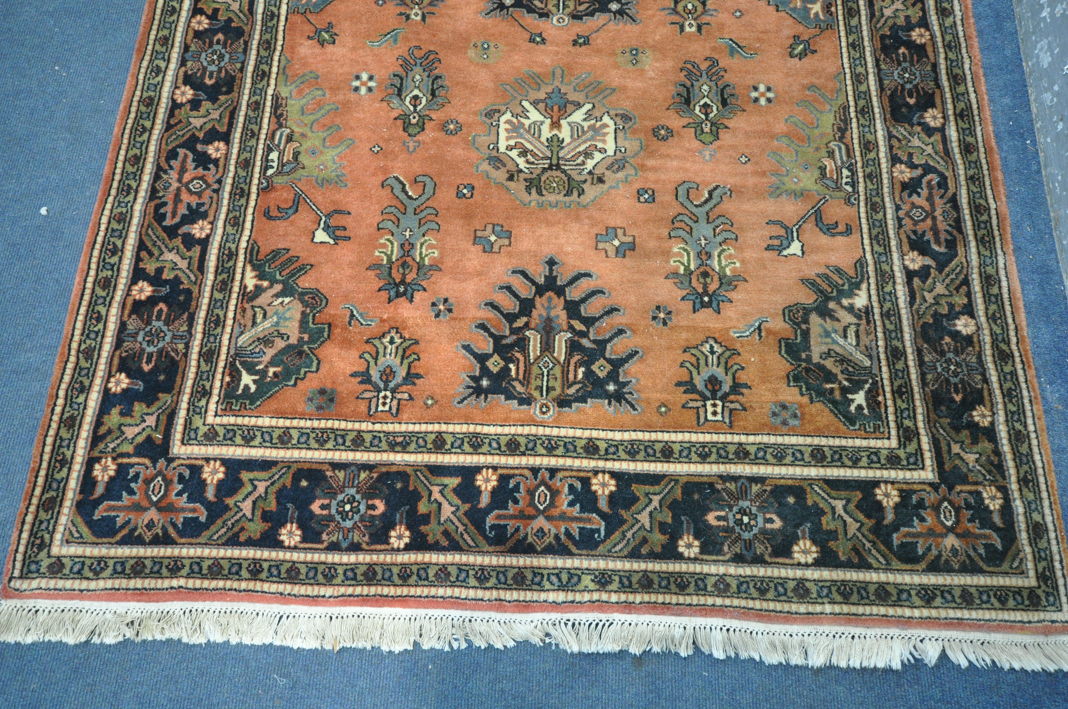 A 20TH CENTURY KULA RUG, with a red field, 250cm x 157cm, along with a gold floral rug, 215cm x - Bild 2 aus 6