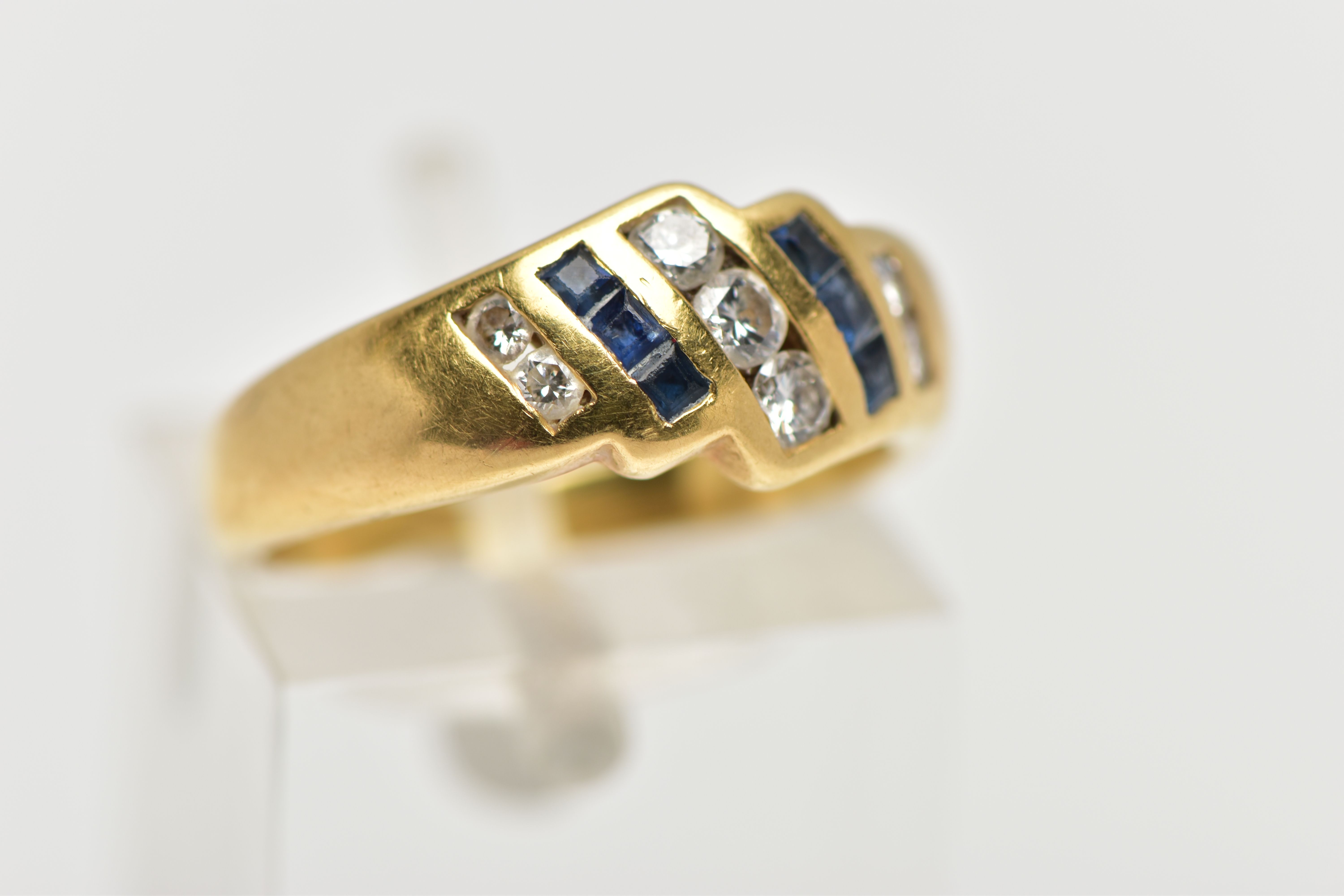 A YELLOW METAL SAPPHIRE AND DIAMOND DRESS RING, of geometric design, the principal brilliant cut - Image 4 of 4