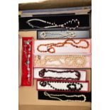 A BOX OF COSTUME JEWELLERY, to include a garnet bead necklace fitted with a lobster clasp, two