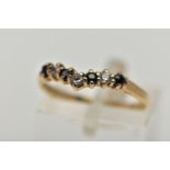 A 9CT GOLD SAPPHIRE AND CUBIC ZIRCONIA WISHBONE RING, the circular cut sapphire and alternately