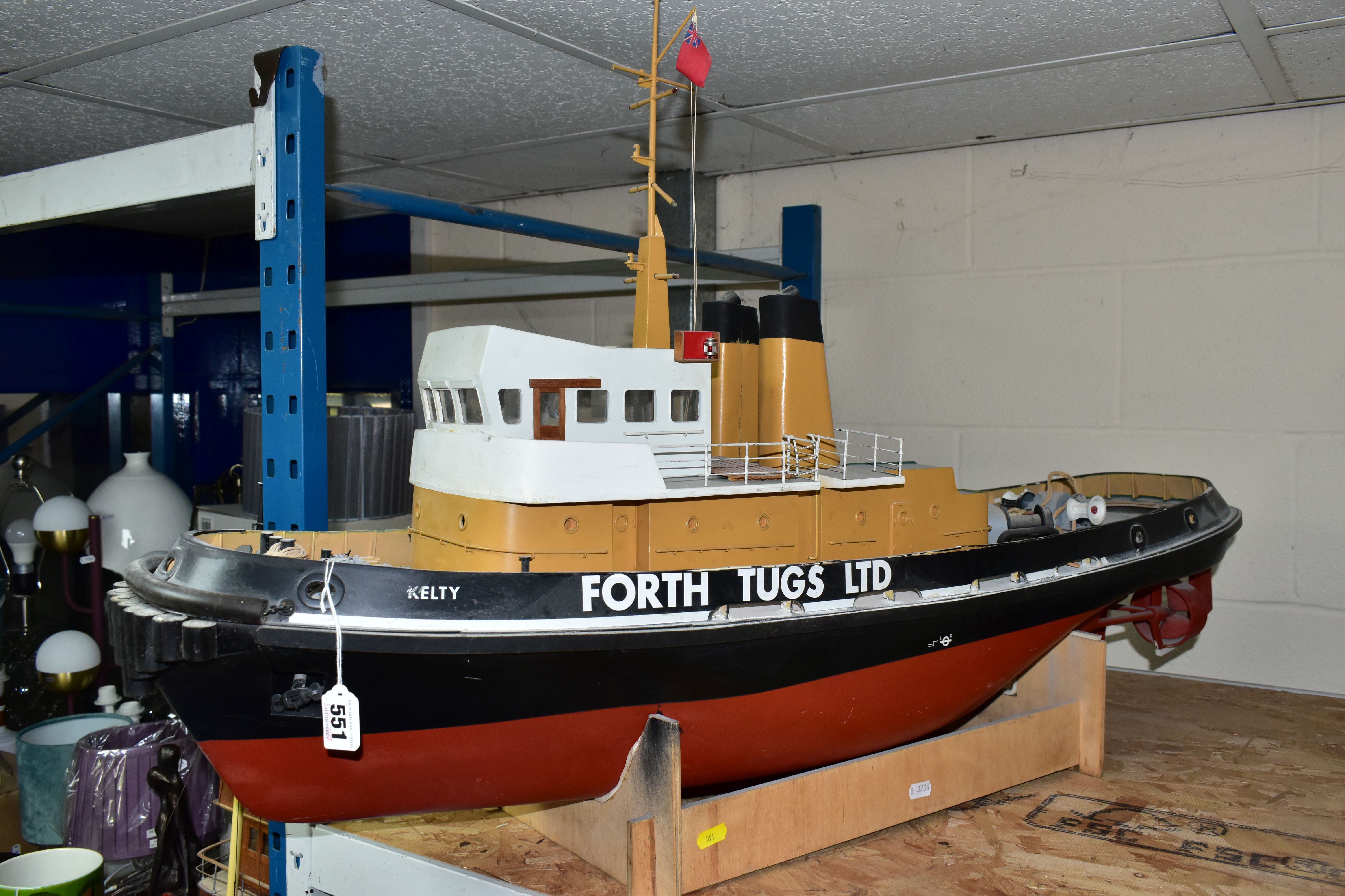 A RADIO CONTROL MODEL OF A TUG BOAT 'KELTY', of fibreglass, wood and plastic construction, fitted