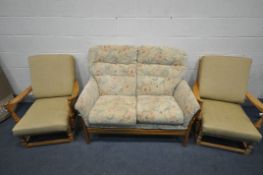 A CINTIQUE ELM TWO SEATER SETTEE, and a pair of Ercol pine armchairs (3)