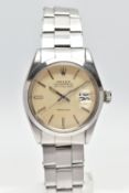 A STAINLESS STEEL 'ROLEX' OYSTER PERPETUAL, automatic movement, round champagne dial, signed 'Rolex'