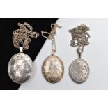 A SELECTION OF SILVER AND WHITE METAL LOCKETS, WITH CHAINS, the first a silver embossed oval locket,