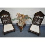 A PAIR OF HARDWOOD ORIENTAL CHAIRS, of very low proportions, with carved foliate detailing to