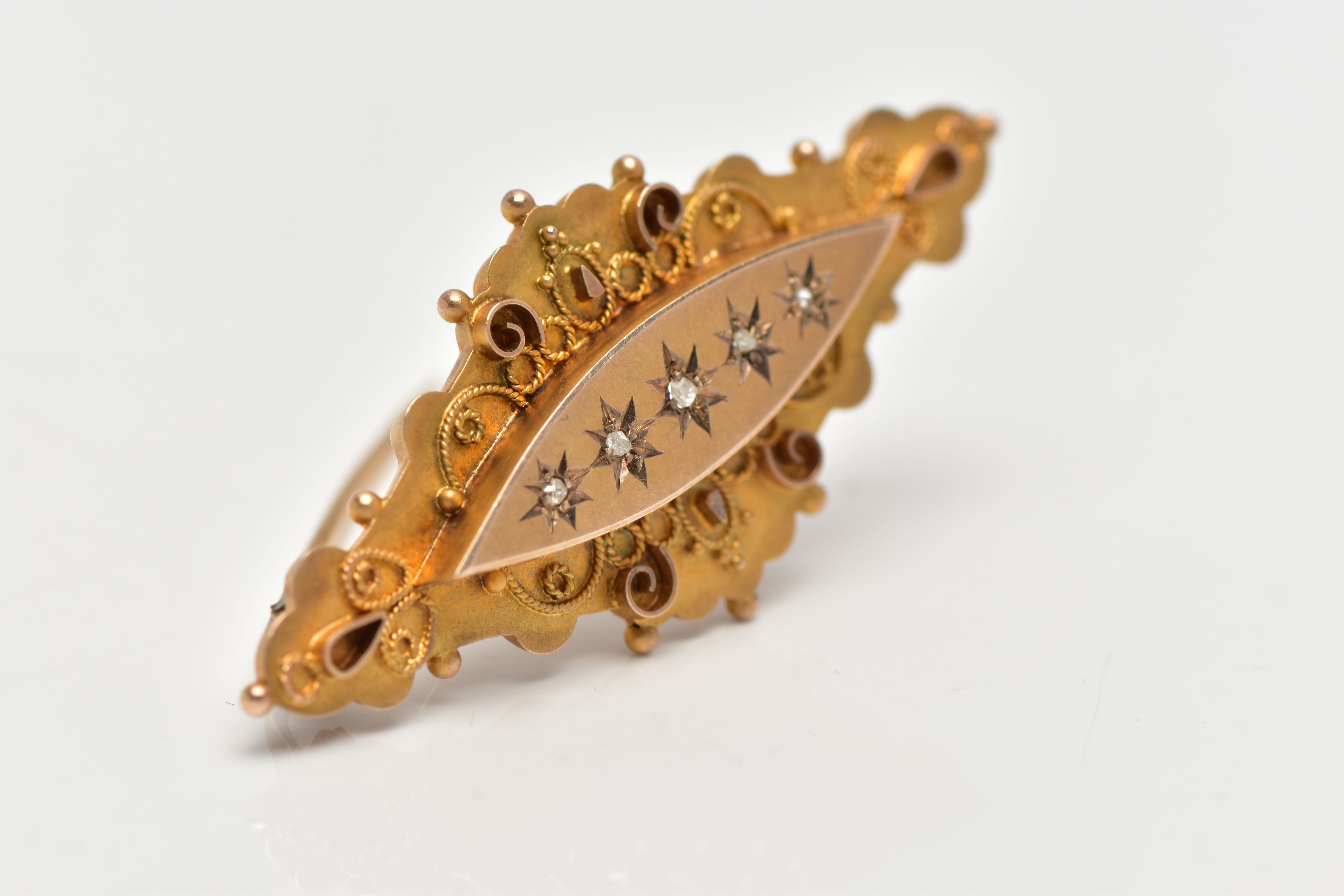 AN EARLY 20TH CENTURY 9CT GOLD DIAMOND BROOCH, designed as a marquise panel, star set with five rose - Image 2 of 3