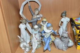 NINE NAO AND LLADRO FIGURES, comprising a Lladro Attentive Cat 5112, sculptor Salvador Debon, issued