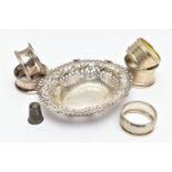 A SELECTION OF SILVER TABLEWARE, to include five early 20th century variously designed silver napkin