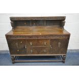A 20TH CENTURY SIDEBOARD, with a raised back, two pivoting drawers, lined with green baize and