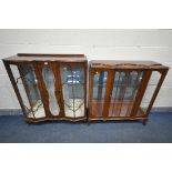TWO WALNUT DISPLAY CABINETS, one with raised back, two glazed doors, a central glazed panel, on