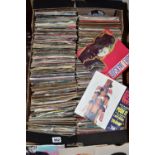 A BOX OF APPROXIMATELY FOUR HUNDRED AND FIFTY VINYL SINGLES, plain and picture sleeves, artists to