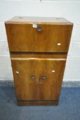 A MID CENTURY METAMORPHIC WALNUT COCKTAIL CABINET, with a mirrored interior, above two cupboard