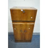 A MID CENTURY METAMORPHIC WALNUT COCKTAIL CABINET, with a mirrored interior, above two cupboard