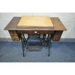 A 20TH CENTURY OAK SINGER TREDLE SEWING MACHINE, the sewing machine folds out of the top, and four