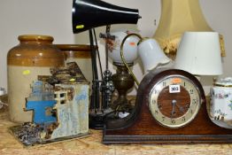 A GROUP OF LAMPS comprising an oak cased mantel clock (with key), three table lamps with shades, a