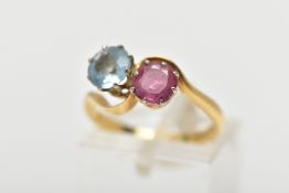 AN 18CT GOLD DRESS RING, a circular cut aquamarine and circular cut glass filled ruby, approximate