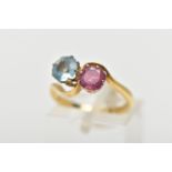 AN 18CT GOLD DRESS RING, a circular cut aquamarine and circular cut glass filled ruby, approximate