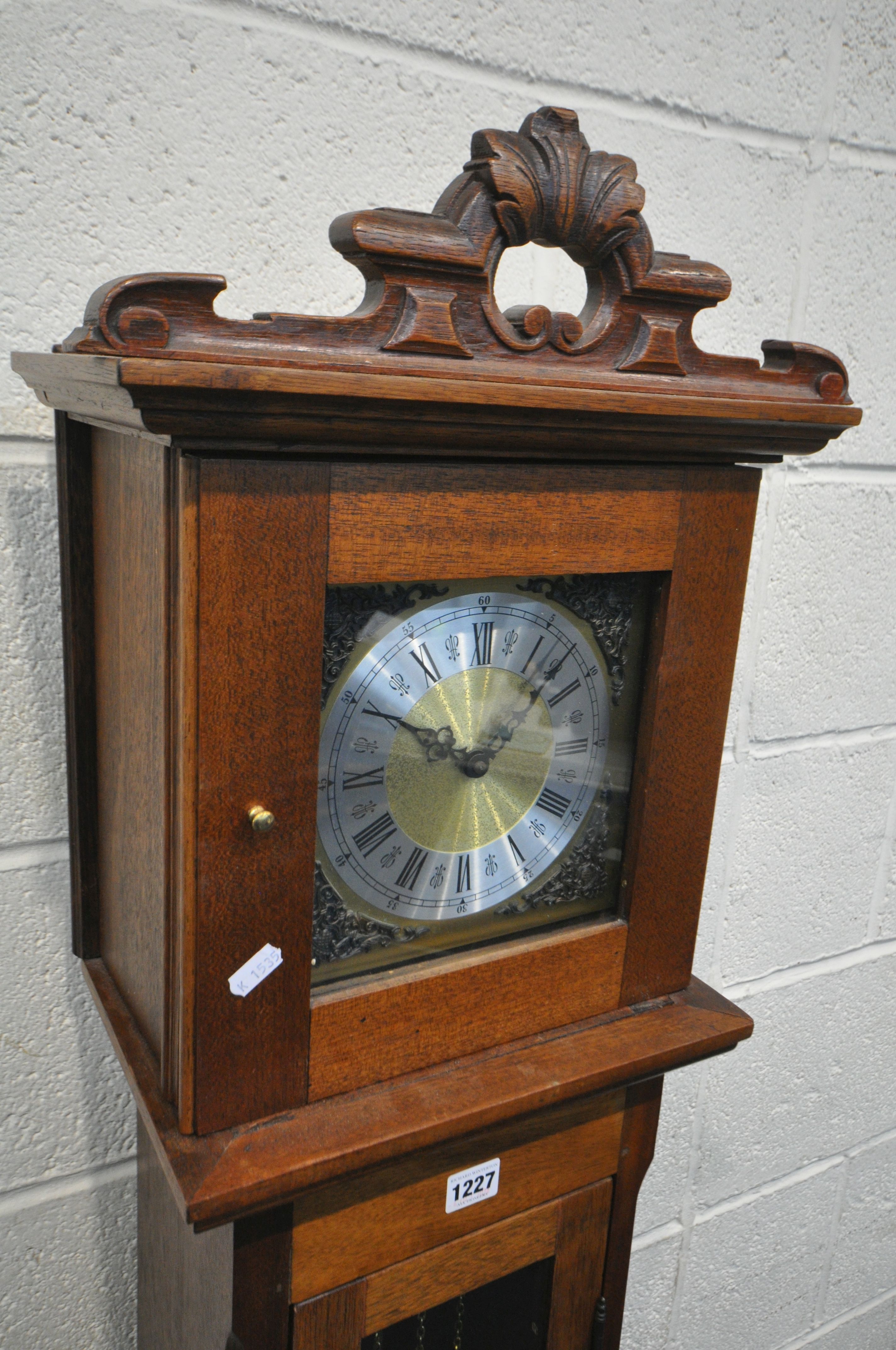 A MAHOGANY GRANDDAUGHTER CLOCK, with a brass and silvered dial, height 168cm, two weights and - Bild 2 aus 2