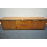 A MID CENTURY TEAK SIDEBOARD, with four cupboard doors, flanking two drawers, length 200cm x depth