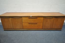 A MID CENTURY TEAK SIDEBOARD, with four cupboard doors, flanking two drawers, length 200cm x depth