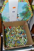 A BOXED CHINESE CHECKERS SET, together with a box of glass marbles