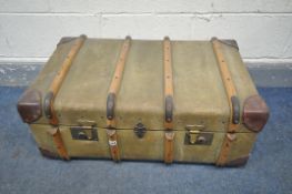 A VINTAGE CANVAS TRAVELLING TRUNK, 78cm x depth 49cm x height 33cm and a distressed domed top trunk,