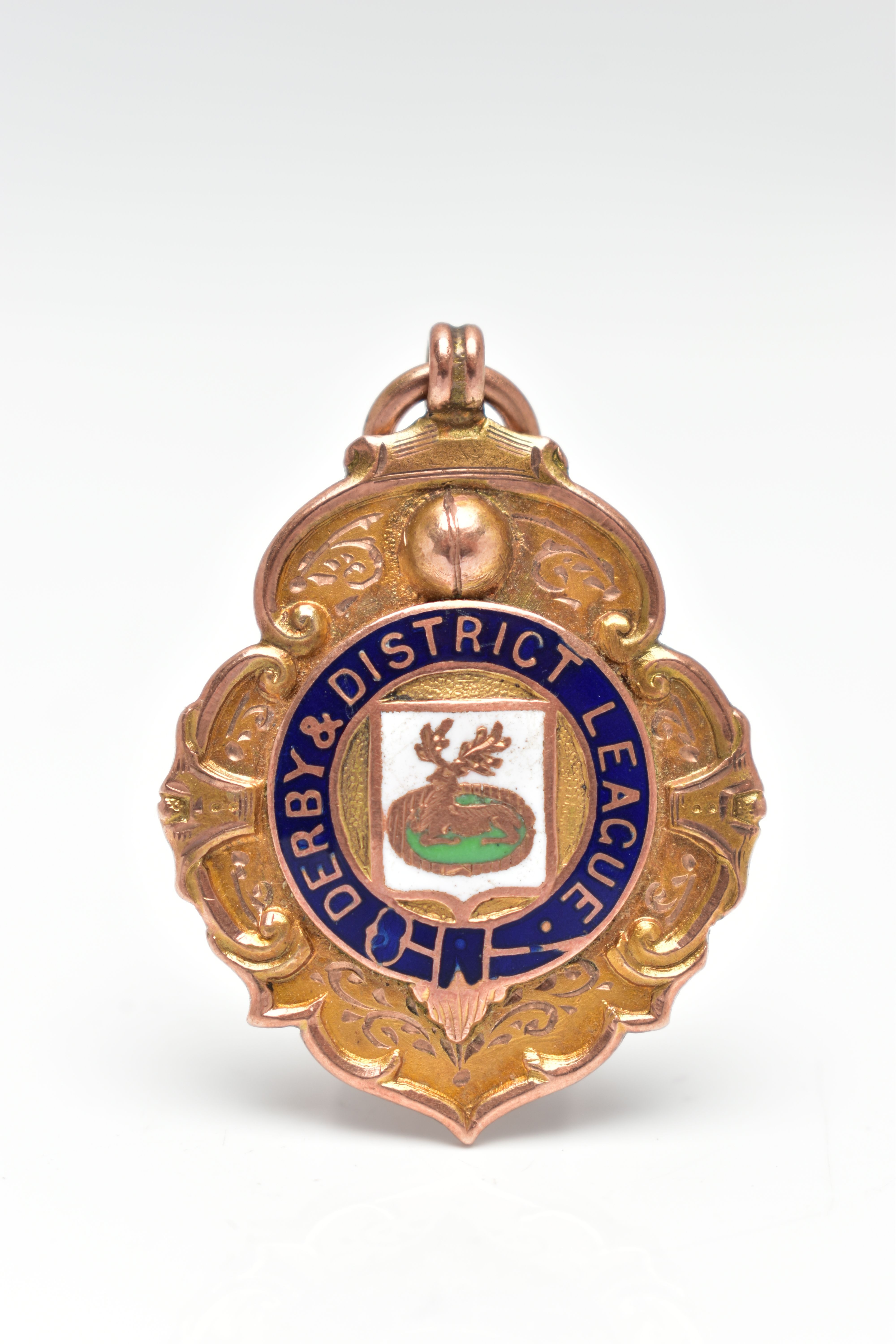 A 9CT GOLD FOB MEDAL, enamel centre with the inscription 'Derby & District League', personal