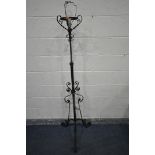 A WROUGHT IRON TELESCOPIC STANDARD LAMP, with scrolled and twisted decoration, maximum height