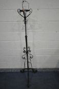 A WROUGHT IRON TELESCOPIC STANDARD LAMP, with scrolled and twisted decoration, maximum height