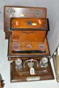 THREE EARLY TO MID 20TH CENTURY WOODEN STATIONERY ITEMS, comprising a desk tidy with two glass ink