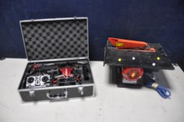 A POTENSIC MINI DRONE WITH CAMERA in case with spare parts and controller along with a Clarke