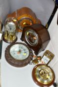 FIVE CLOCKS AND TWO BAROMETERS, comprising a Weston Super quartz wall clock, Hermle quartz