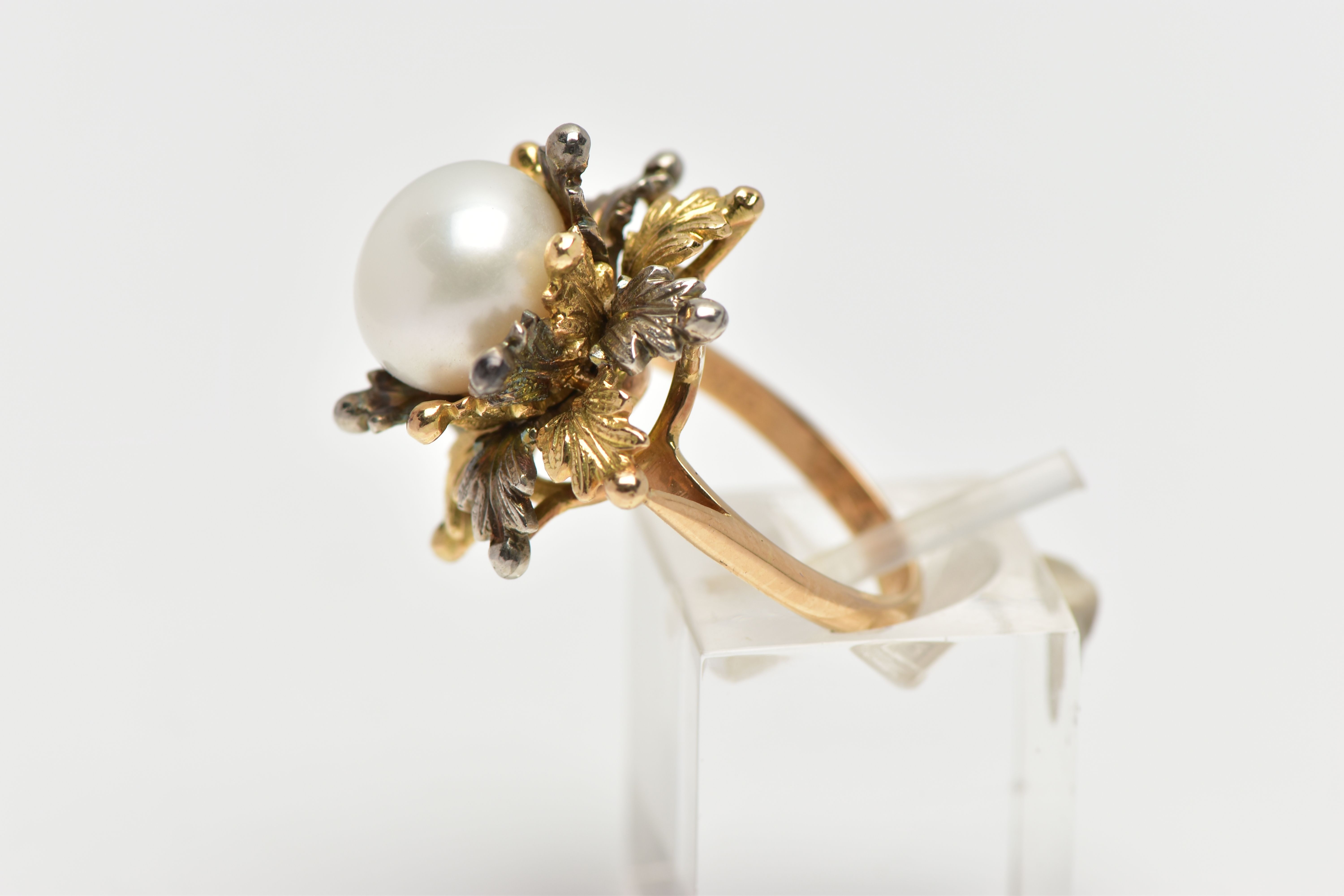 A WHITE AND YELLOW METAL CULTURED PEARL RING, of foliate design, set with a principal part drilled - Image 2 of 4