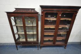 A VICTORIAN MAHOGANY GLAZED TWO DOOR BOOKCASE, enclosing four adjustable shelves, on ball and claw