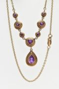 A 9CT GOLD AMETHYST NECKLACE, the pear cut collet amethyst drop, suspended from a circular cut