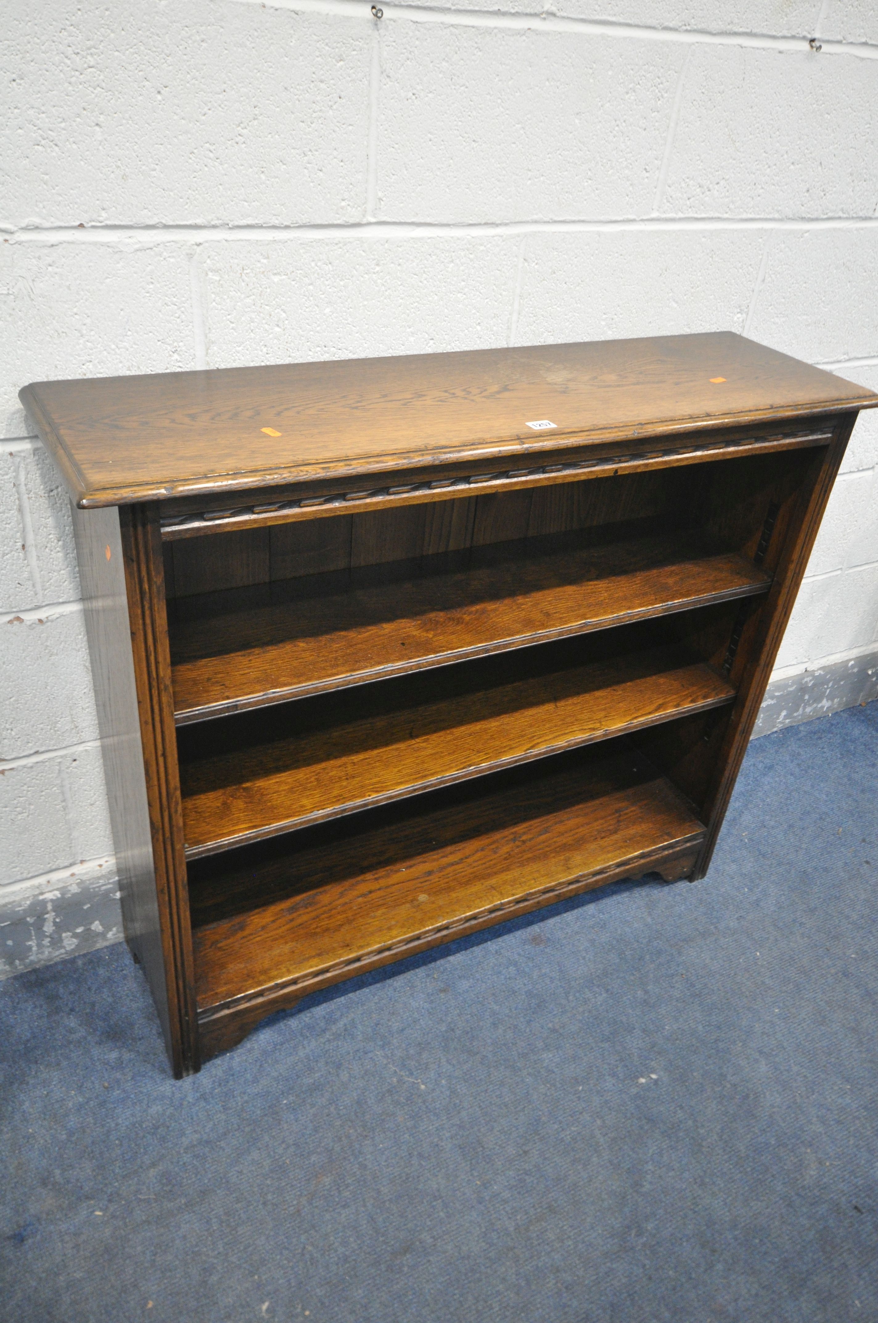 A SOLID OAK OPEN BOOKCASE, with two drawers, width 107cm x depth 31cm x height 91cm (condition:-
