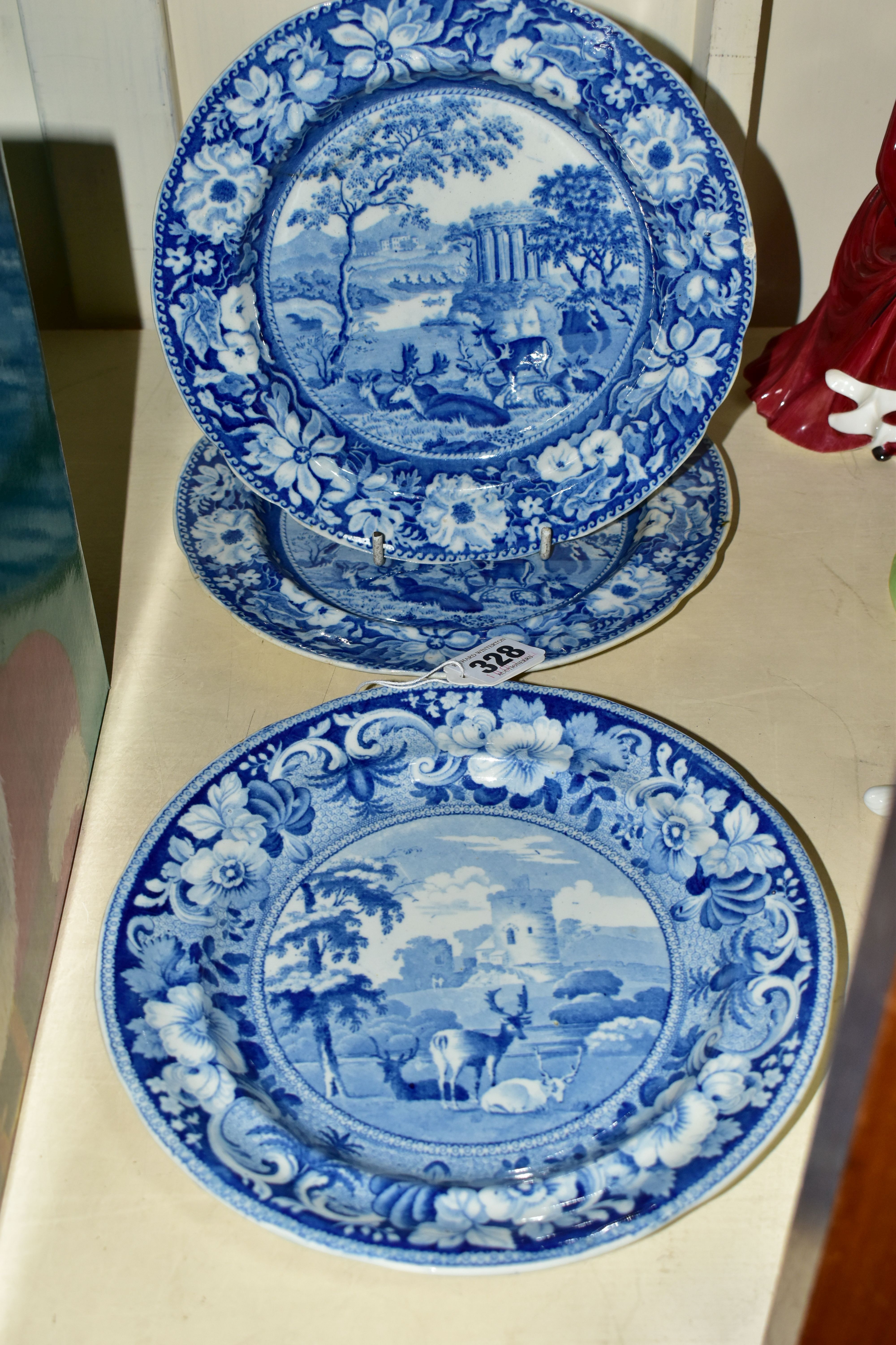 THREE SMALL NINETEENTH CENTURY BLUE AND WHITE PLATES, transfer printed with deer in the landscape,